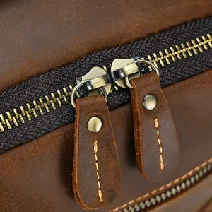 Men genuine leather backpack detail shot showcasing vintage crazy horse texture and metal zipper.