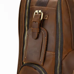Vintage crazy horse leather backpack detail view showing premium cowhide texture and zippers.