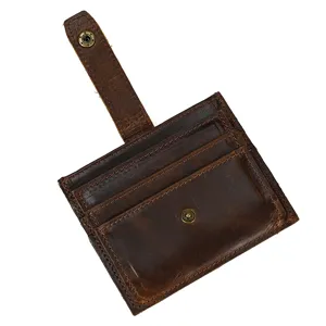 Genuine leather card holder with multiple card slots and snap button closure for daily use.