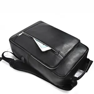 Detail view of men's genuine leather business backpack in black, showing smooth zipper pocket.