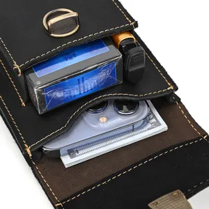Detailed view of black crazy horse leather phone waist bag showing interior storage capacity.
