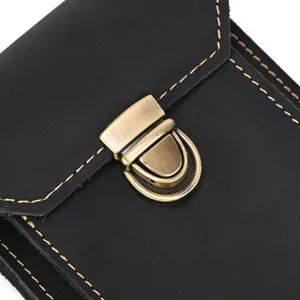 Detail view of black crazy horse leather phone waist bag with vintage bronze metal lock.