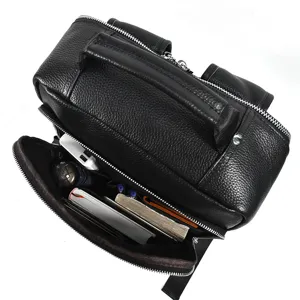 Men leather backpack interior detail shot, large capacity multi-compartment storage design.