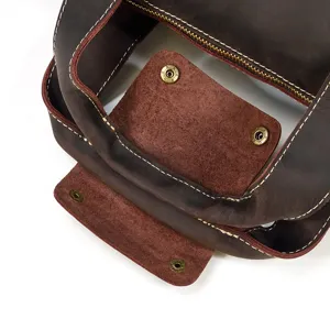 Men vintage crazy horse leather bag detail view showing fine stitching and metal snaps hardware.
