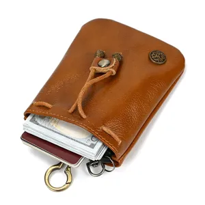 Vintage genuine leather coin purse mini wallet with drawstring and metal key ring storage.