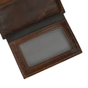 Close-up view of vintage genuine leather card holder interior with transparent photo ID window.