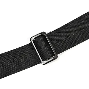 Close-up of durable black nylon shoulder strap with adjustable metal buckle for bags.