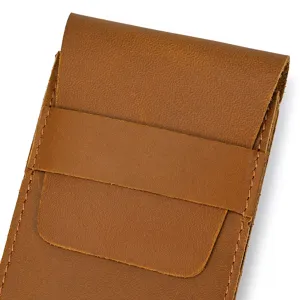 Detailed view of the vintage brown leather watch pouch, showing fine stitching and texture.