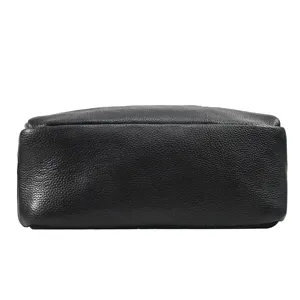 Detailed bottom view of men black genuine leather business backpack with fine texture.