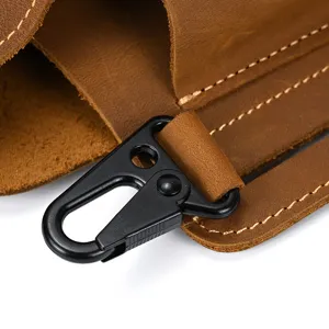 Close-up detail of vintage crazy horse leather men waist bag with durable metal hook.