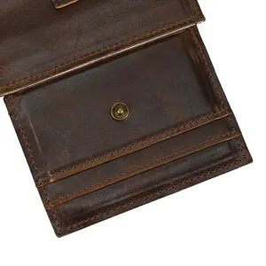 Close-up detail shot of dark brown genuine leather card wallet featuring multi-card slots and snap.