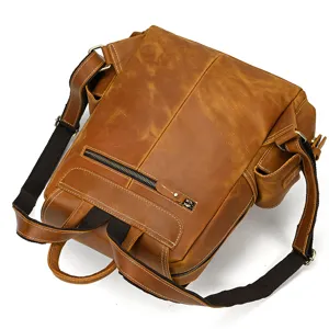 Detail view of vintage crazy horse leather men backpack with sturdy straps and secure zipper pocket.