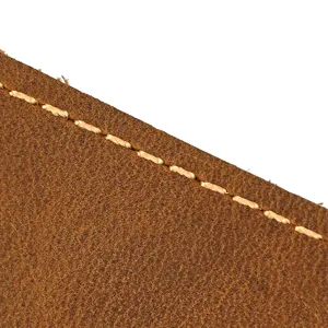 Closeup of brown crazy horse leather phone waist bag detailed stitching and texture.