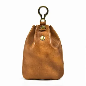 Detailed view of retro vegetable tanned leather mini coin purse with brass snap closure.