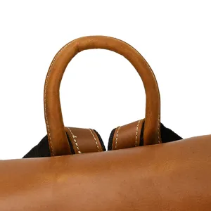 Vintage crazy horse leather backpack handle detail, genuine leather men travel bag top view.