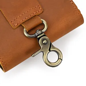 Crazy horse leather phone waist bag detail view with vintage bronze metal lobster clasp hook.