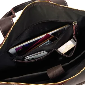 Men's vintage leather briefcase interior detail, multi-pocket business laptop bag capacity.