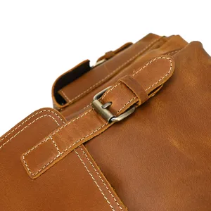 Vintage crazy horse leather backpack detail shot showcasing genuine leather texture and metal buckle.
