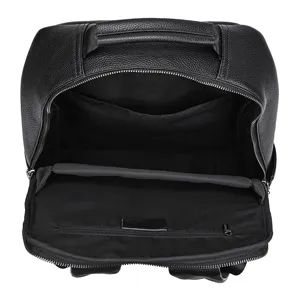 Interior detail of black leather men business backpack with multiple storage pockets and compartments.