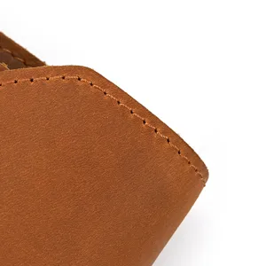 Close-up detail of premium crazy horse leather phone pouch showing fine stitching and texture.