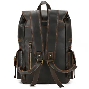Detail view of vintage crazy horse leather backpack, dark brown multi-pocket design for men.