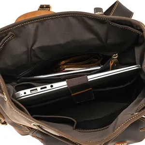 Vintage leather backpack interior detail, spacious compartment with laptop sleeve for travel.
