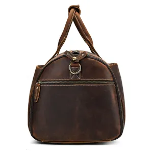 Detailed view of the vintage brown leather travel duffel bag showcasing premium texture and zippers.
