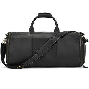 Detail view of the black leather travel duffel bag, showing fine stitching and smooth zippers.