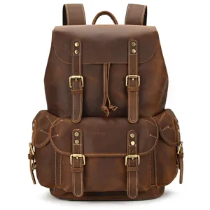 Vintage brown leather backpack detail showing premium mad horse leather texture and brass hardware.