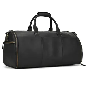 Black genuine leather travel duffel bag with durable handles and multiple zipper compartments.