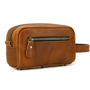 Vintage brown genuine leather toiletry bag with zipper pocket and side handle for travel.