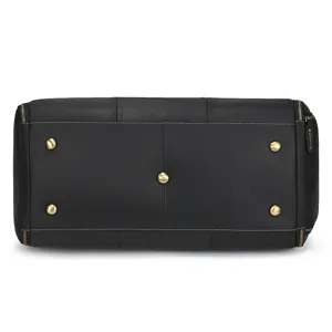 Bottom detail view of black leather travel bag featuring brass metal feet and zippers.