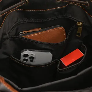 Detailed view of the vintage leather backpack interior showing organized storage compartments.