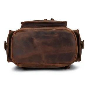 Detail view of vintage crazy horse leather backpack bottom, showing durable stitching and structure.