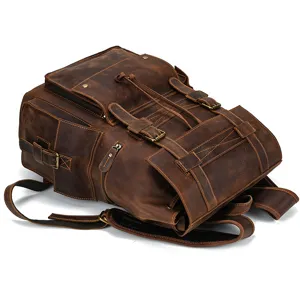 Detailed view of vintage genuine leather backpack, multi-pocket design, durable hardware.