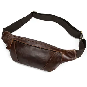 Detailed view of the brown leather chest bag showing fine texture and durable strap.