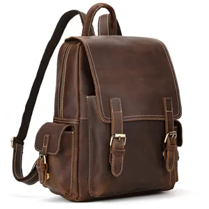 Vintage crazy horse leather backpack detail featuring durable metal buckles and secure flap pockets.