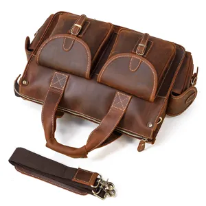 Close-up detail of vintage crazy horse leather briefcase with multi pockets and shoulder strap.