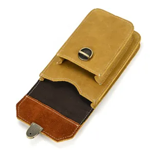 Close up detail of vintage crazy horse leather phone holster with metal buckle and belt loop.