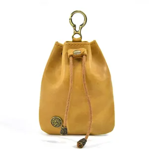 Vintage handmade vegetable-tanned leather mini coin pouch with drawstring and metal hook.