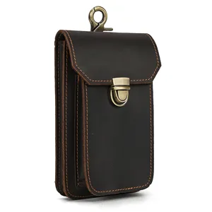 Close-up detail of vintage genuine crazy horse leather phone waist bag with metal hardware.
