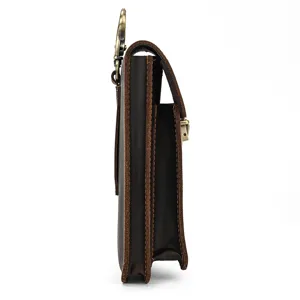 Side detail view of genuine leather phone holster pouch with metal belt hook and multi compartments.