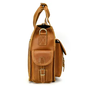 Vintage leather briefcase side detail, multi-pocket cowhide business bag close-up view.