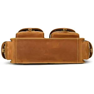 Vintage brown leather briefcase detail view showing multi-pocket design and solid bottom.