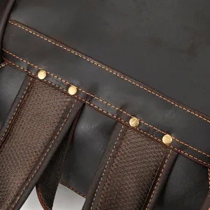 Vintage crazy horse leather backpack detail view, durable genuine leather with contrast stitching.