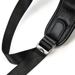 Detail view of men leather backpack strap and metal buckle, durable nylon webbing design.