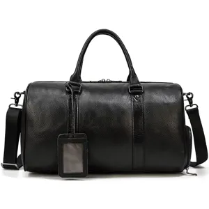 Leather travel duffel bag detail shot, premium black cowhide texture, sturdy metal hardware.