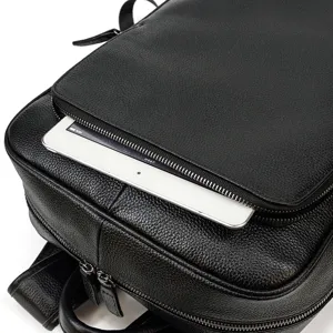 Men genuine leather laptop backpack detail view, black cowhide business casual backpack pocket.