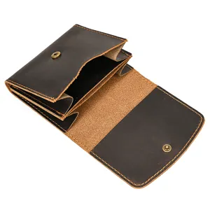 Detailed view of brown genuine leather coin purse with snap button and vintage crazy horse style.