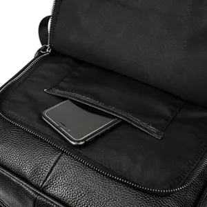 Men genuine leather business backpack detail view with interior pocket and phone slot.